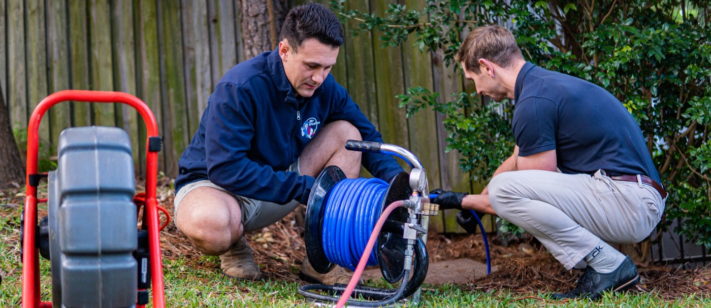 Mr Drains team fixing blocked sewer drain